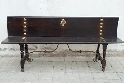 Baroque palace entrance bench with the Cross of Santiago and bronze and oak wood rivets from 