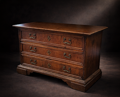 Walnut shed with three drawers, Italy, 20th century. Walnut wood, worked and assembled. 