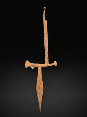 Throwing knife-coin. Matakan village, Nigeria. 19th–20th century. Iron. Dimensions: 81 &times; 26 cm. 