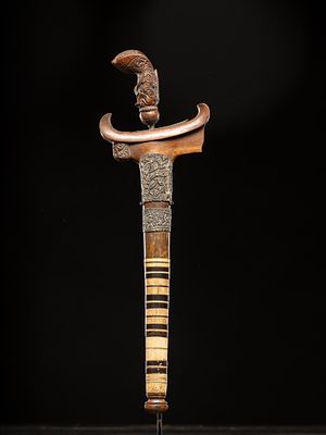 Indonesian dagger. Indonesia, 20th century. Wood and bone. Dimensions: 47.5 &times; 14.5 &times; 3 cm. 