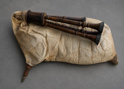 19TH CENTURY EUROPEAN SCHOOL - Traditional Bagpipe. Turned wood, leather, and fabric. Measures 