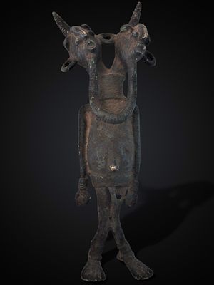 Two-headed bronze ritual figure, Nigerian culture, 20th century. Cast bronze. Double-headed 
