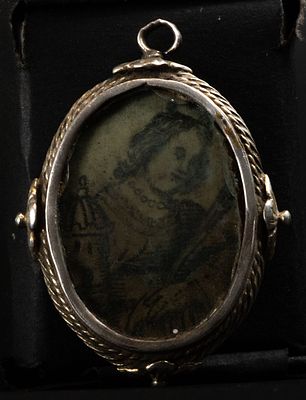 Small silver pendant reliquary of Saint Barbara on parchment, 17th century. In silver. 