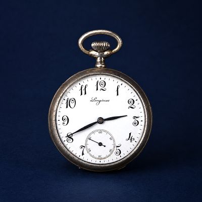 Longines silver watch, Swiss School, 19th century. Silver and enamel. Dimensions: 6 x 4 x 1.5 