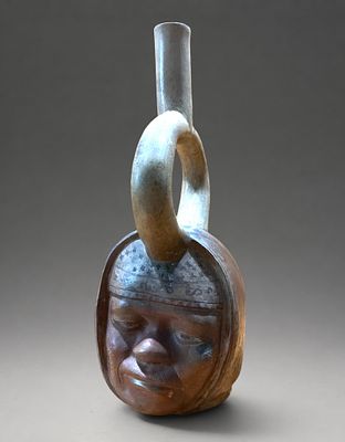 Anthropomorphic stirrup-shaped portrait vessel, Moche Culture, 600-800 AD. Modeled ceramic with 