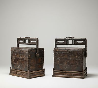 Pair of dowry chests, Qing Dynasty Chinese School, 19th Century. Wood with a dark patina and 