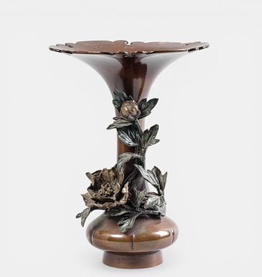 Wide-opening horn-shaped vase with a climbing peony branch. Standing flat on its back with a 