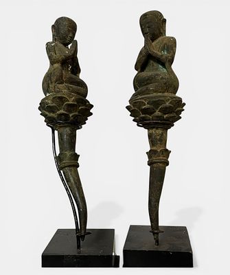 A couple of worshippers with two disciples kneeling on an open lotus branch. Bronze. Burma. 19th 