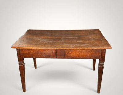 Walnut table with two drawers and tapered legs. Spanish School. 17th century. Walnut. 
