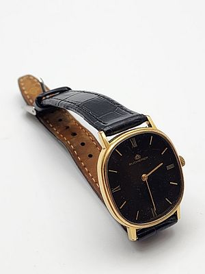 שעון יד דקס יוקרתי וינטג' תוצרת Bucherer שוויץ, שנות ה-70 בקירוב. קופסא פלדת אל חלד מוזהבת 