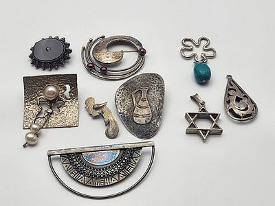 Collection of 9 Old Silver Jewels – Lapel Brooches and Vintage Pendants in the "Maskit" Style 
