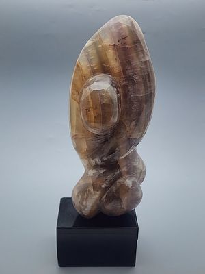Ida Nitzani, Figure, a hand-carved sculpture in brown veined stone (possibly fluorite). Mounted 