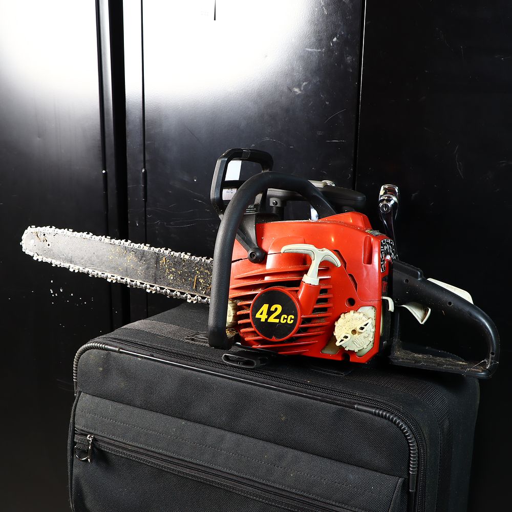 Lot 312: Homelite 18 inch chainsaw and extra chains