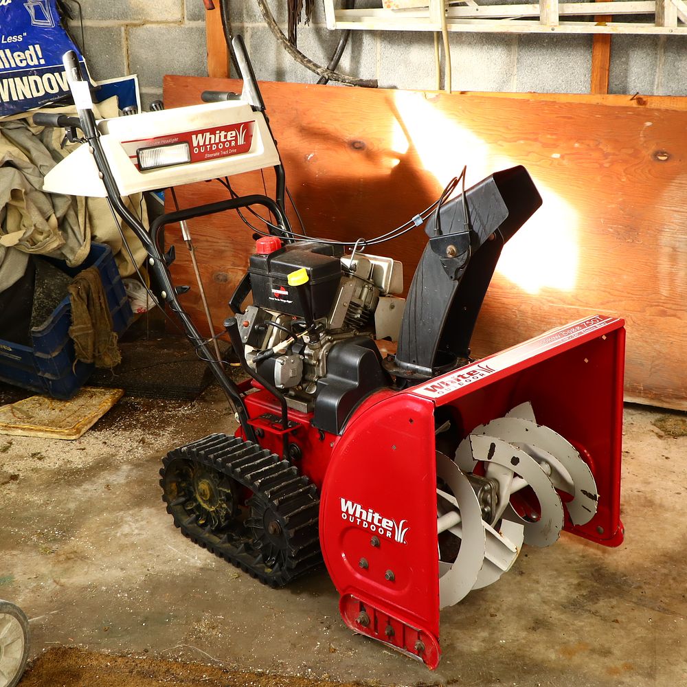 Lot 199: White Outdoor Snow Boss 750T 7 hp 24” Track Drive electric start snow blower
