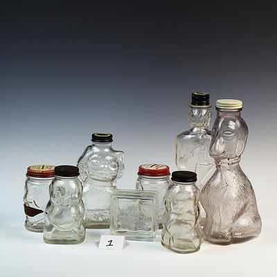 Lot of 8 Glass Banks the tallest is 10 inches high