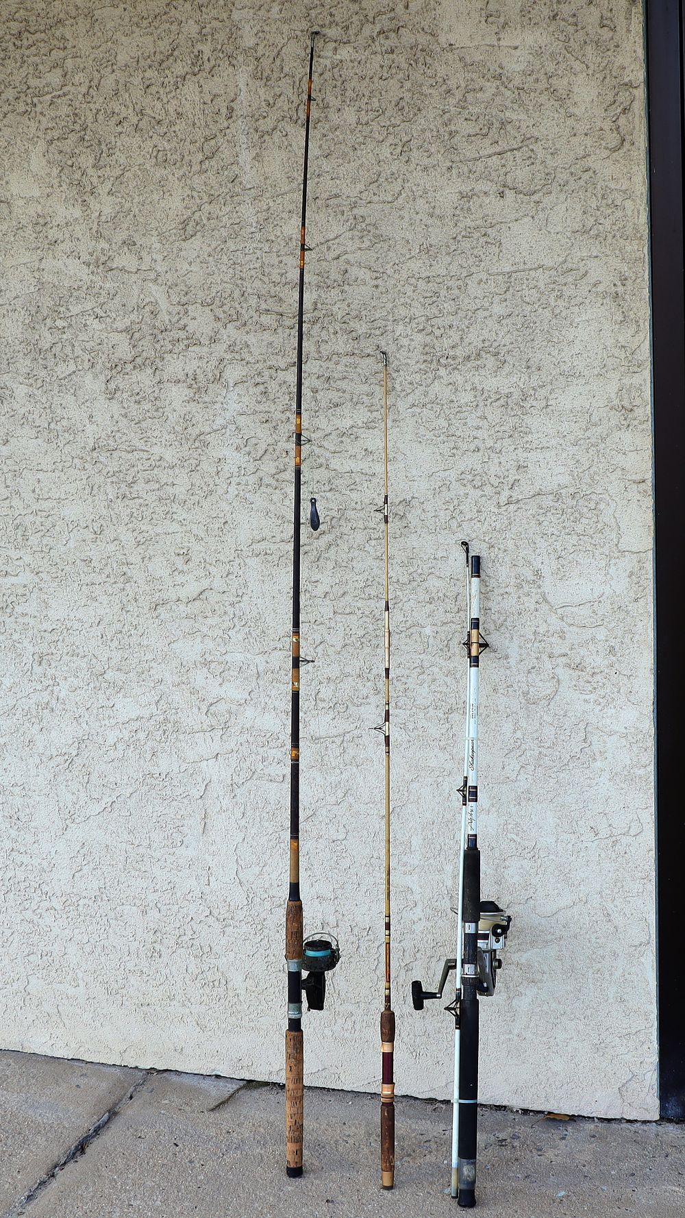 Lot 280: Lot of Three Vintage Fishing Rods and Reels