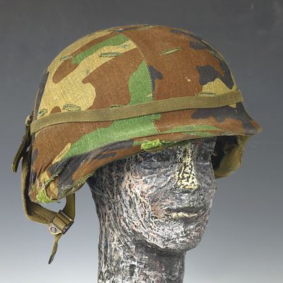 Vietnam War US M1 Infantry Helmet With Mitchell Cover. Antique vintage military fabric and 