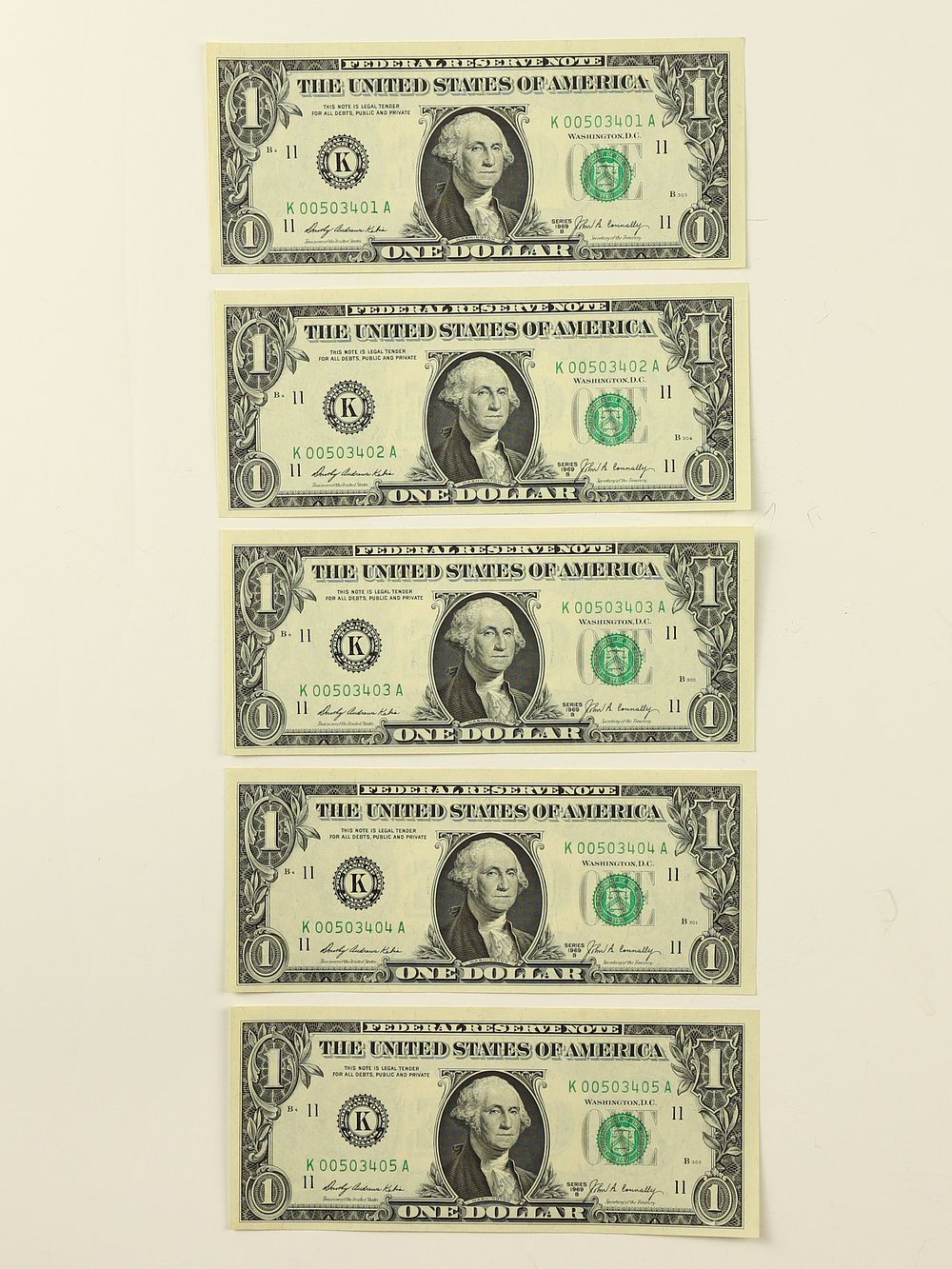 Lot 217: Five low consecutive serial number “oo” 1969 B series $1 bills