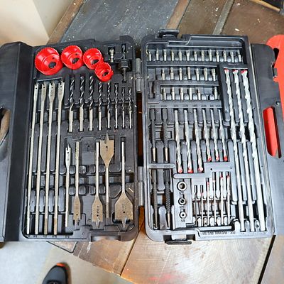 Large Drill Bit and Hole Saw Set. Drill bits, nut drivers and hole saws in a storage and