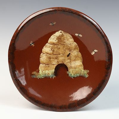 Oxford Earthenware Redware Bee Skep Charger by Tomashausky, 1997. A contemporary redware 