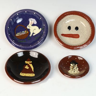 A Group of Hand-Painted Seasonal Earthenware Dishes and Bowls. A group of four decorative 