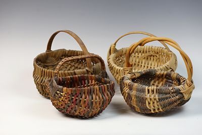 A Collection of Hand-Woven Ribbed Baskets in the Buttock Style. A collection of multiple 