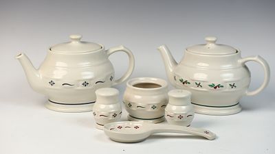 A Collection of Longaberger Pottery Woven Traditions and Holiday Pattern Stoneware. This 