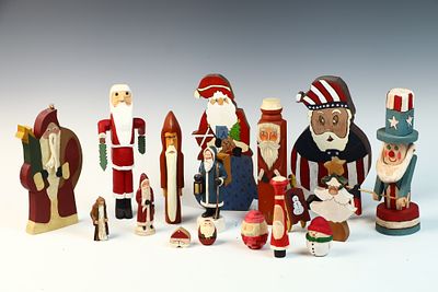 A Collection of Sixteen Hand-Carved and Hand-Painted Wooden Folk Art Holiday Figures. This lot 