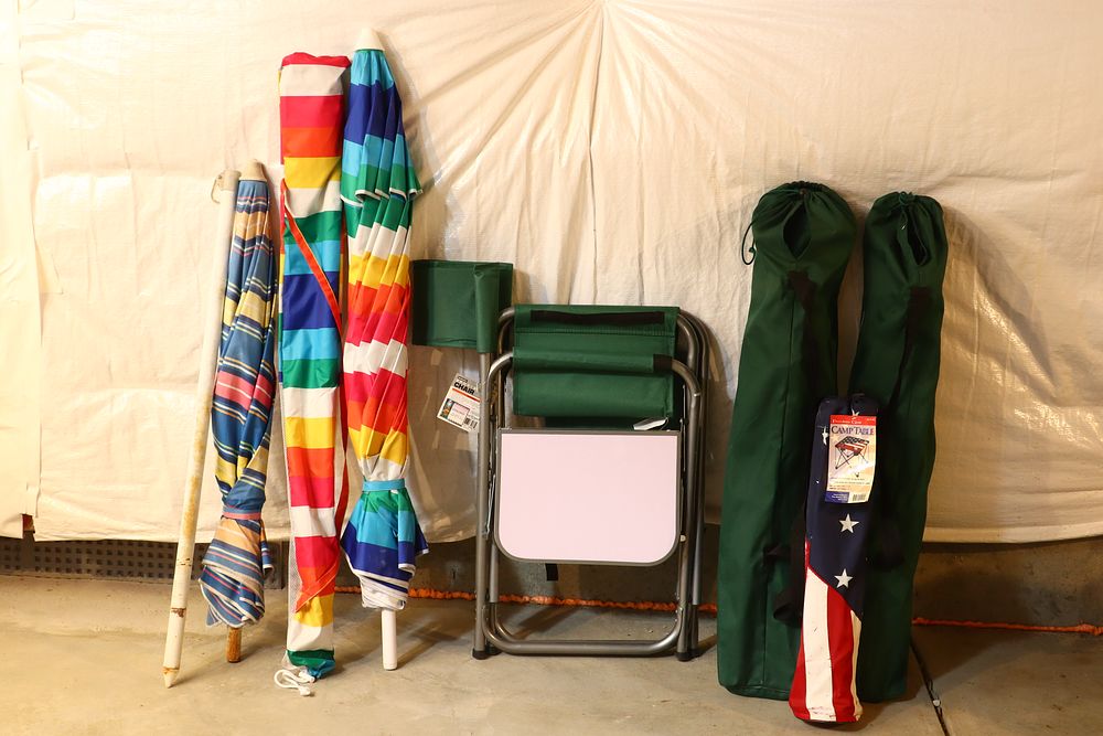 Lot 195: An Assortment of Outdoor Recreational Gear including an Attributed Picnic Time Folding Sports Chair and Beach Umbrellas