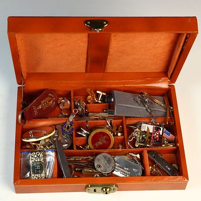 A Collection of Vintage Men's Jewelry and Memorabilia in an Orange Leatherette Valet Box. An 
