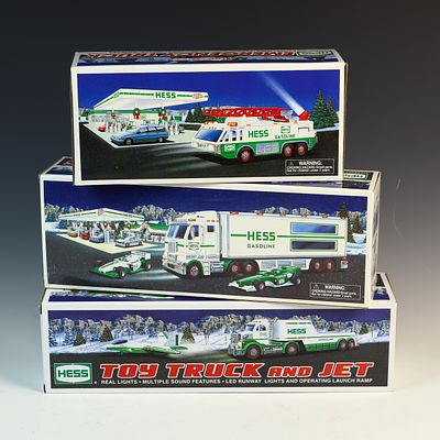 Three Hess Toy Truck Sets Including 1996 Emergency Truck, 2003 Truck and Racecars, and 2010 