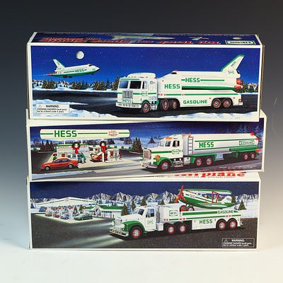 Three Hess Toy Truck Sets Including 1990 Tanker, 1999 Space Shuttle, and 2002 Airplane. A trio 