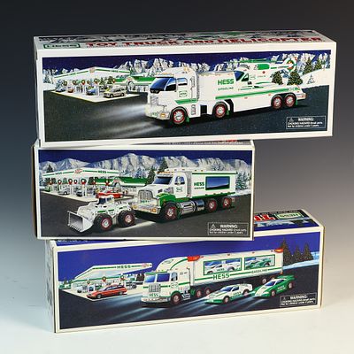 Three Hess Toy Truck Sets Including 1997 Truck and Helicopter 2006 Truck and Racers and 2008 