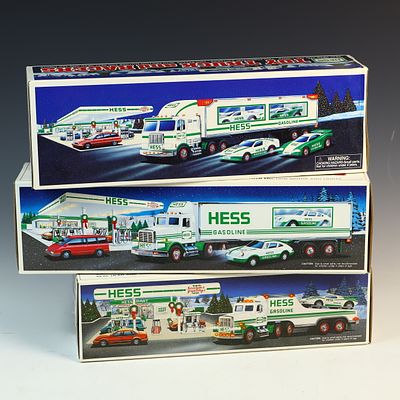 Three Vintage Hess Toy Truck and Racer Sets in Original Boxes. A trio of vintage toy truck sets 