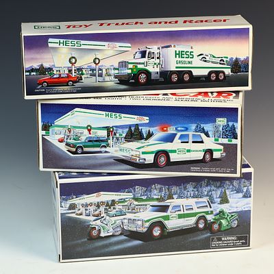 Three Vintage Hess Toy Vehicle Sets Including 1988 Truck and Racer, 1993 Patrol Car, and 2004 