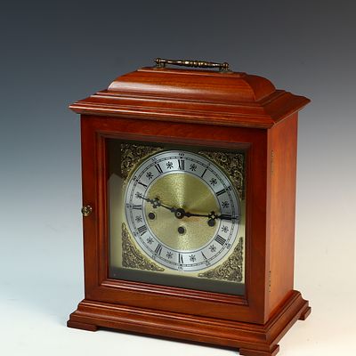 US Quartz Bracket-Style Chime Mantel Clock in Wood Case. This bracket-style mantel clock is 