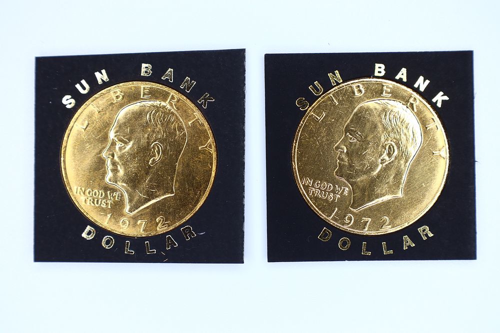 Lot 166: A Pair of US 1972 Eisenhower Dollars with Aftermarket Gold Plating, Sun Bank Promotion
