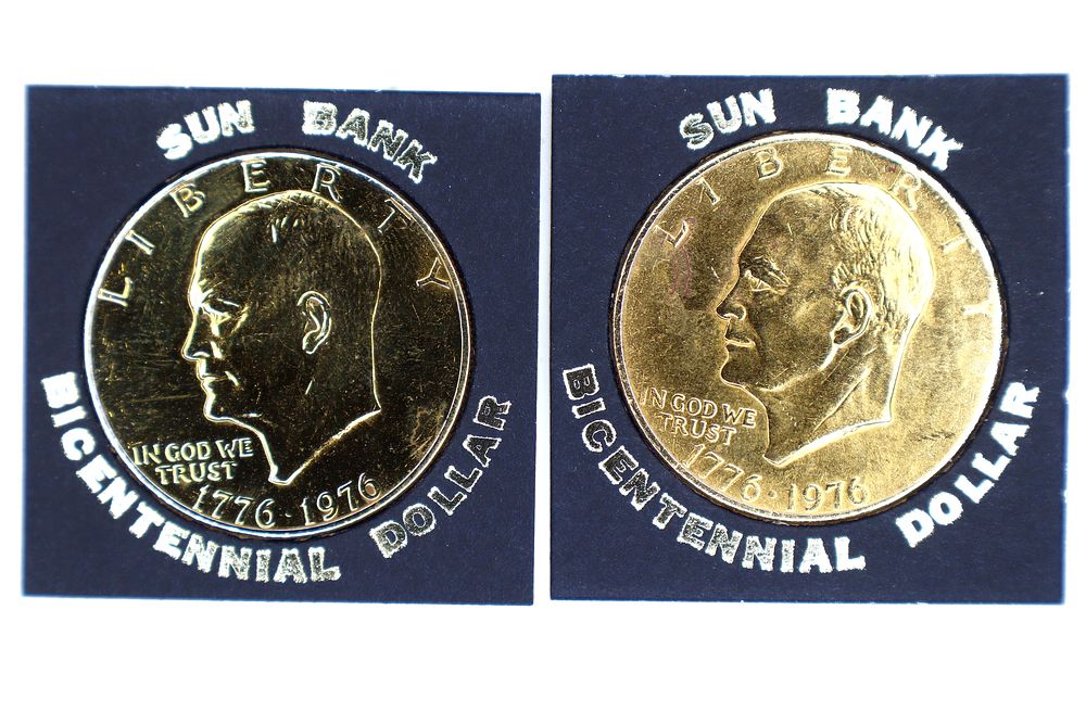 Lot 180: A Pair of US Bicentennial 1776-1976 Gold-Plated Eisenhower Dollars in Sun Bank Flips