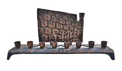 The Western Wall menorah, made of brass, 1960s, signed.
Dimensions: 19.5X9X5 cm.