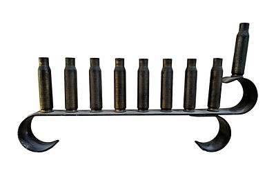 A vintage military menorah made of rifle holsters, handmade with an interesting design!