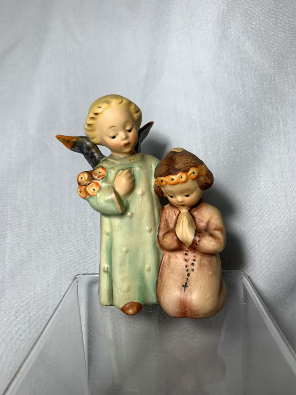 Lot 194: Hummel Angel & Child .