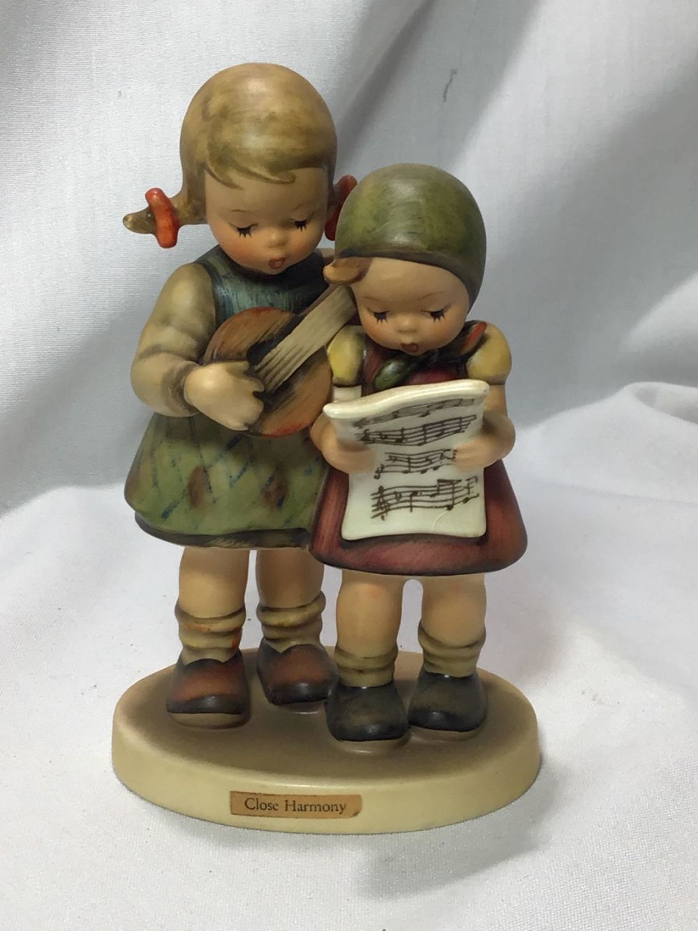 Lot 180: Hummel Figurine " Close Harmony" .