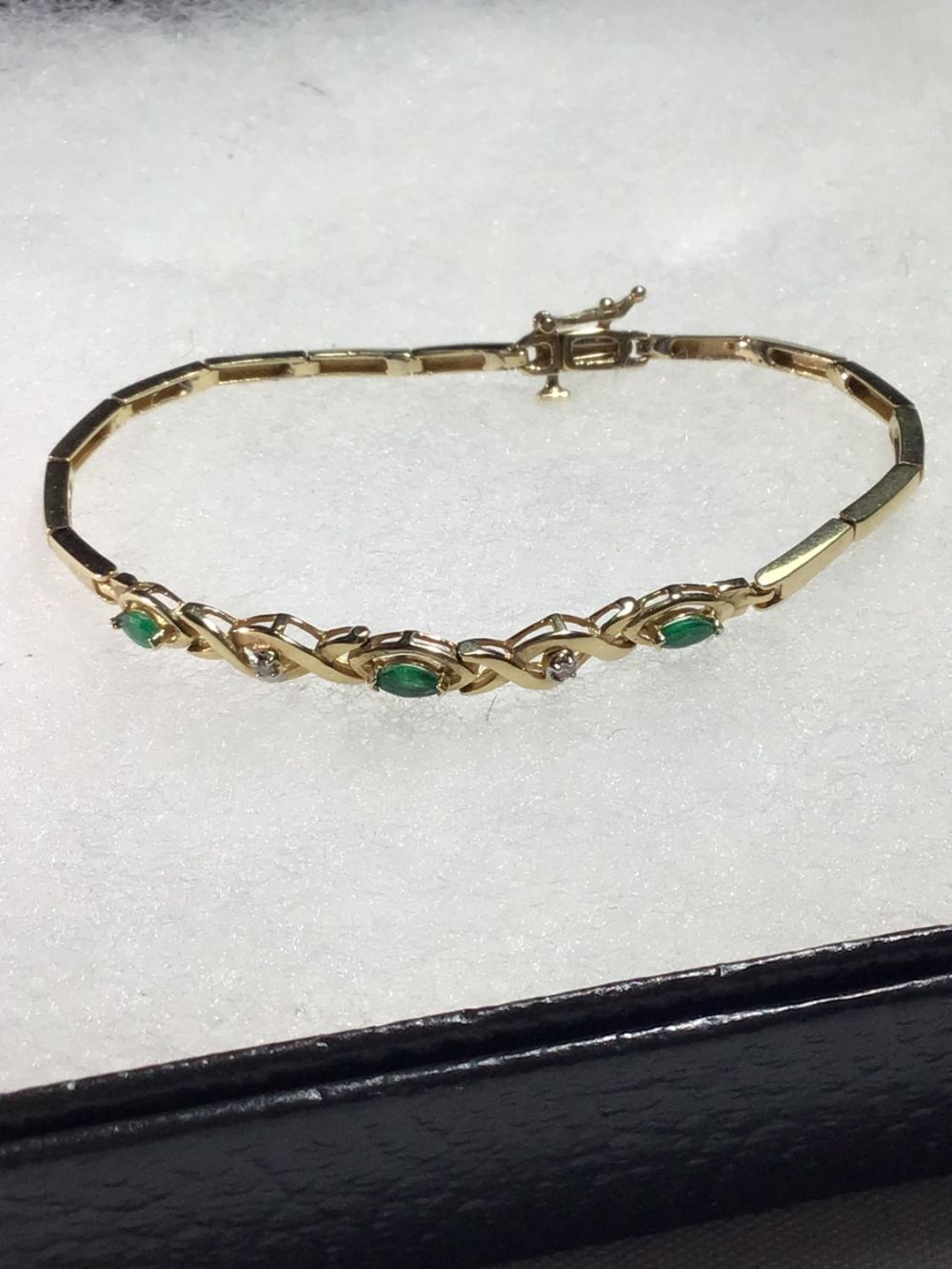 Lot 172: 14 k Gold green Emerald Bracelet w diamond Chips .