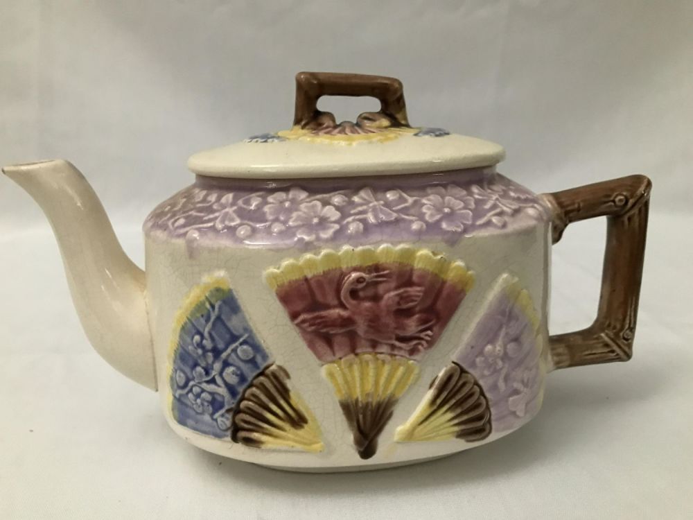 Lot 245: Majolica Tea Pot , 10 inches long 6 inches
