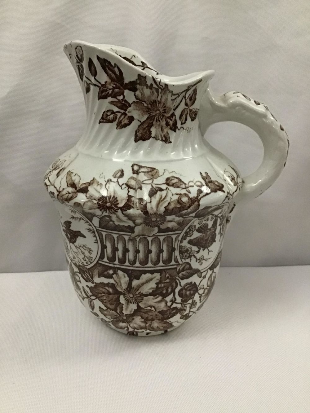 Lot 258: Staffordshire  Creamer Measures 6.5 inches tall