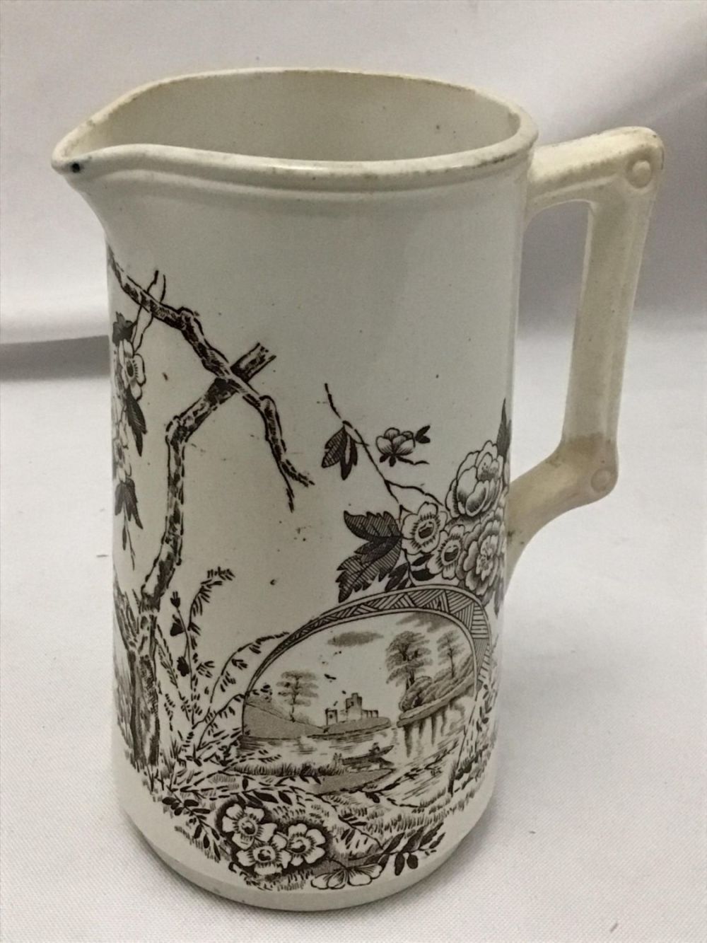 Lot 189: Staffordshire Water Pitcher hairline crack in
