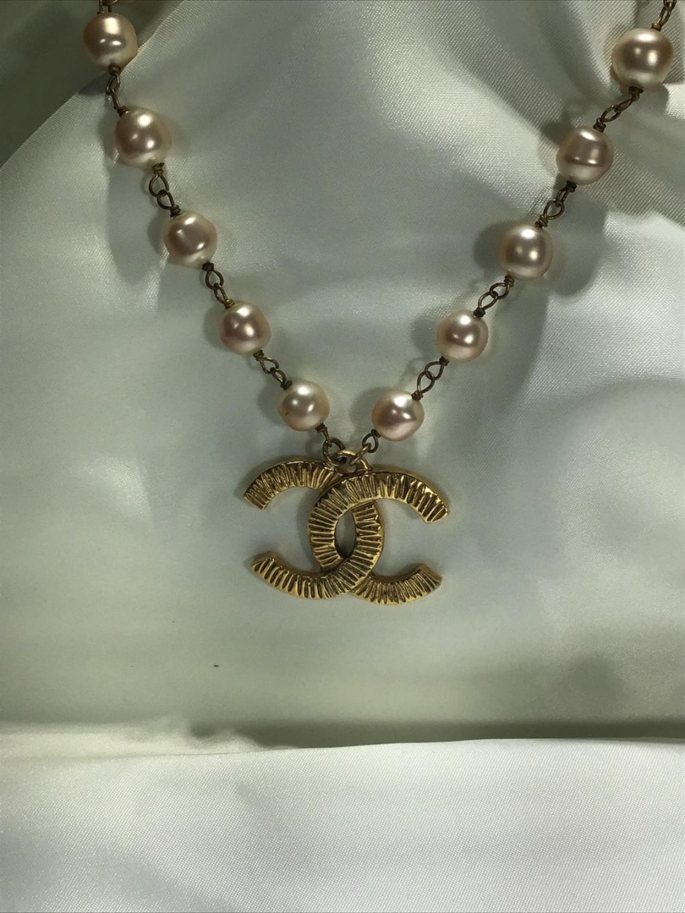 Lot 196: Vintage CoCo Chanel Necklace, Pearl Logo Tagged and