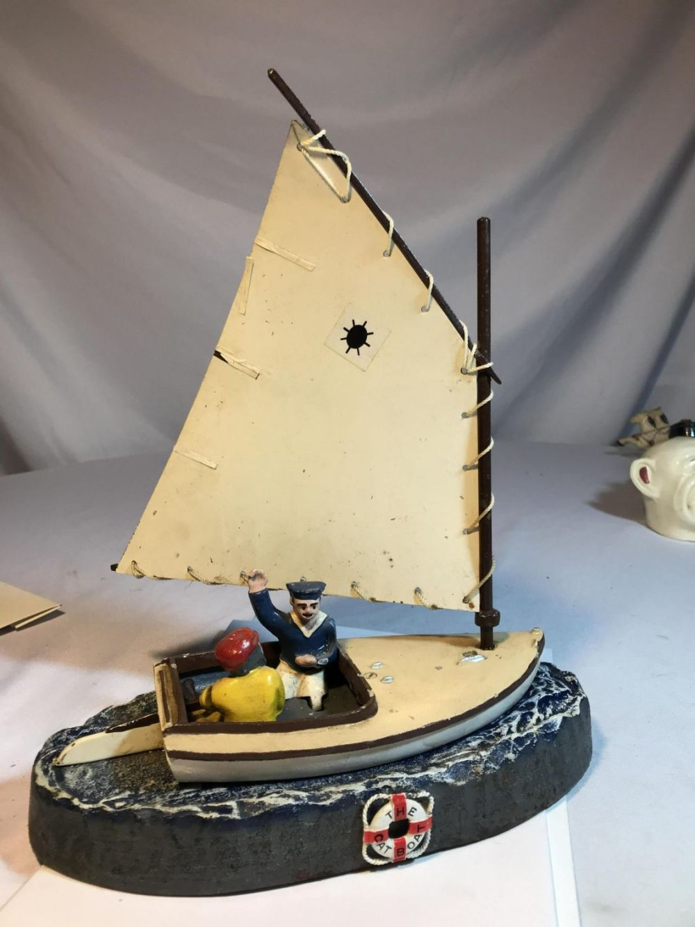 Lot 152: Mechanical - The Cat Boat Bank Cast Iron