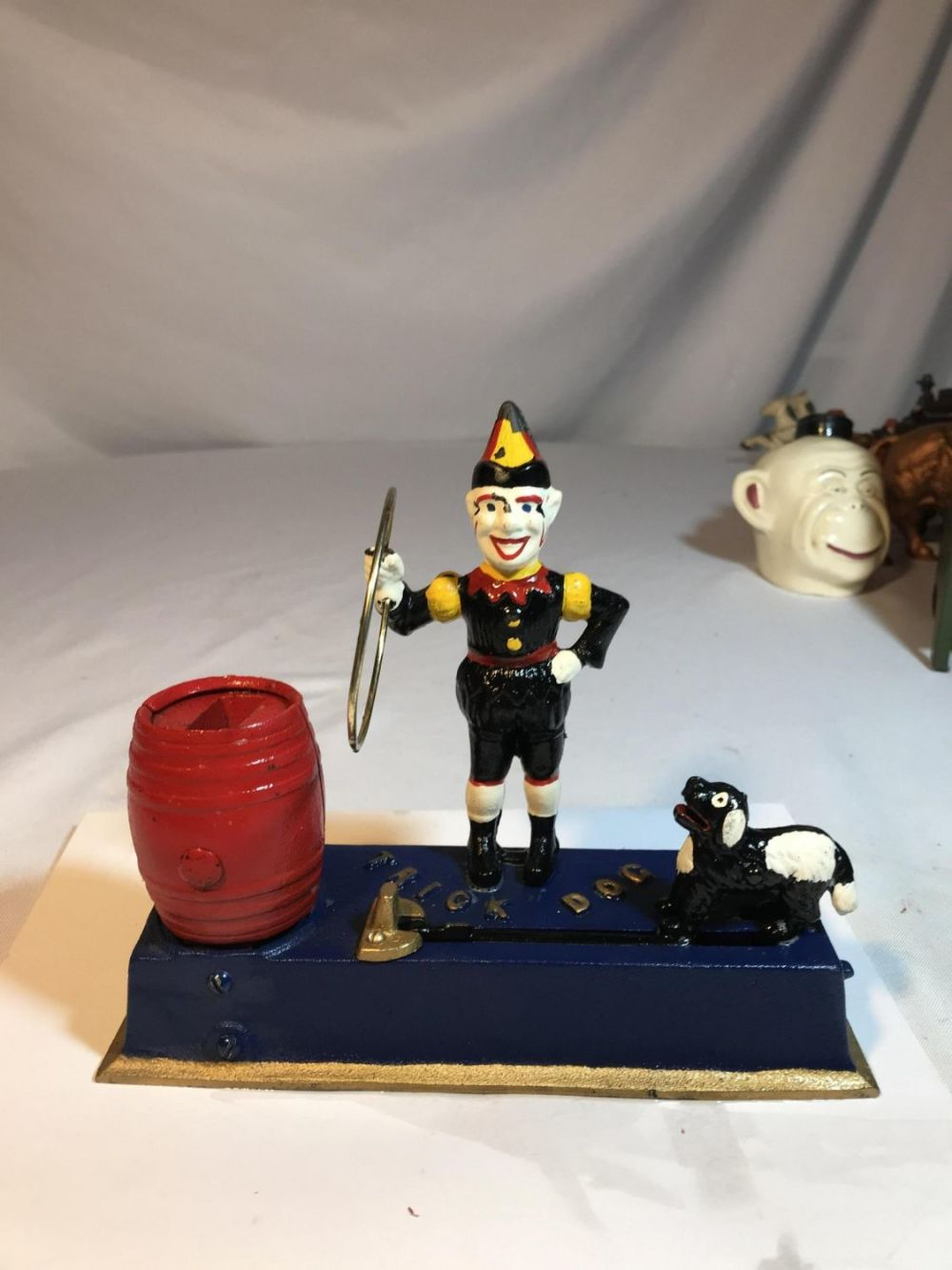 Lot 154: Mechanical Trick Dog w/ Terrifying Clown Cast Iron Approximately 8  by 6 1/2
