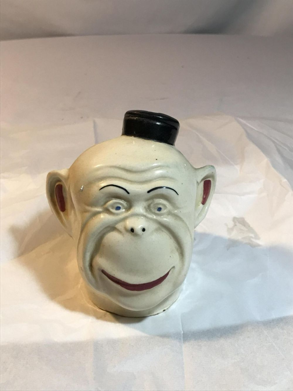 Lot 180: Vintage Monkey Face Bank - Filled w/ coins Approximately 4